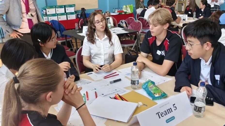 UK and Chinese students collaborating during a group learning activity.