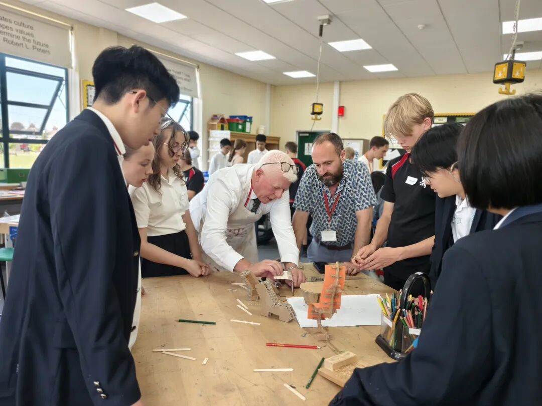 Students from The King John School and East Shanghai High School working through prototype ideas with staff during the Design for Life STEM Challenge.